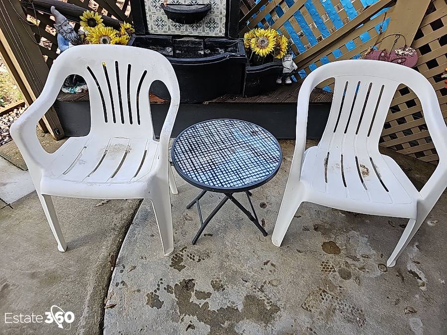 Two Plastic Patio Chairs And Side Table Auction